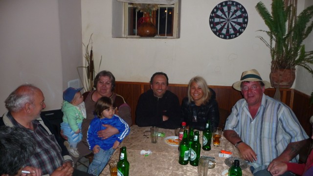 Elly Roupcheva with Francis Tapon in a pub with Englishmen in Turkincha, Bulgaria